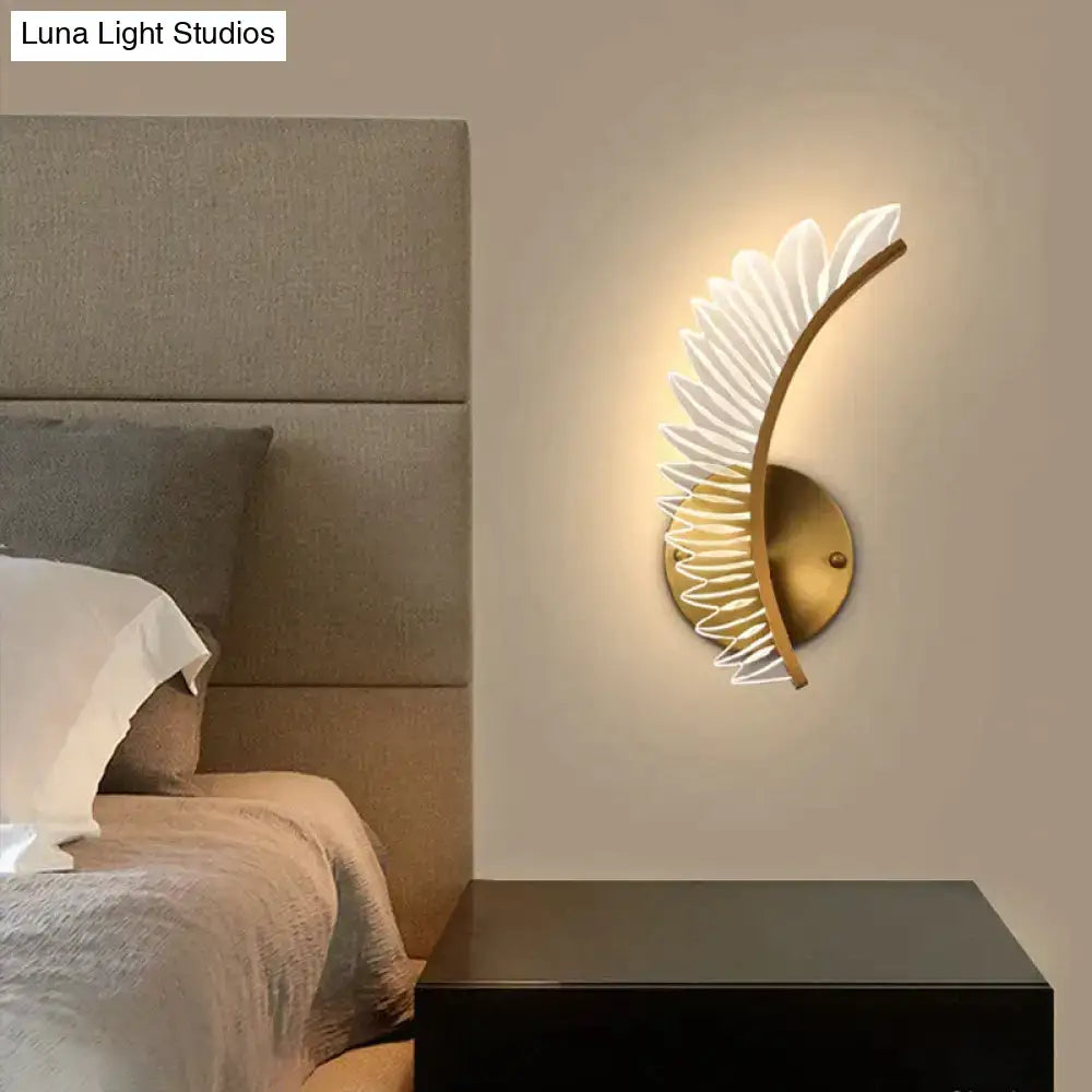 Gold-toned nordic modern art wall lamp featuring a white feather-like design for modern art bedside use