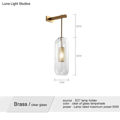 A brass pendant wall lamp with a clear glass lampshade and e27 bulb holder for nordic modern decor bedroom