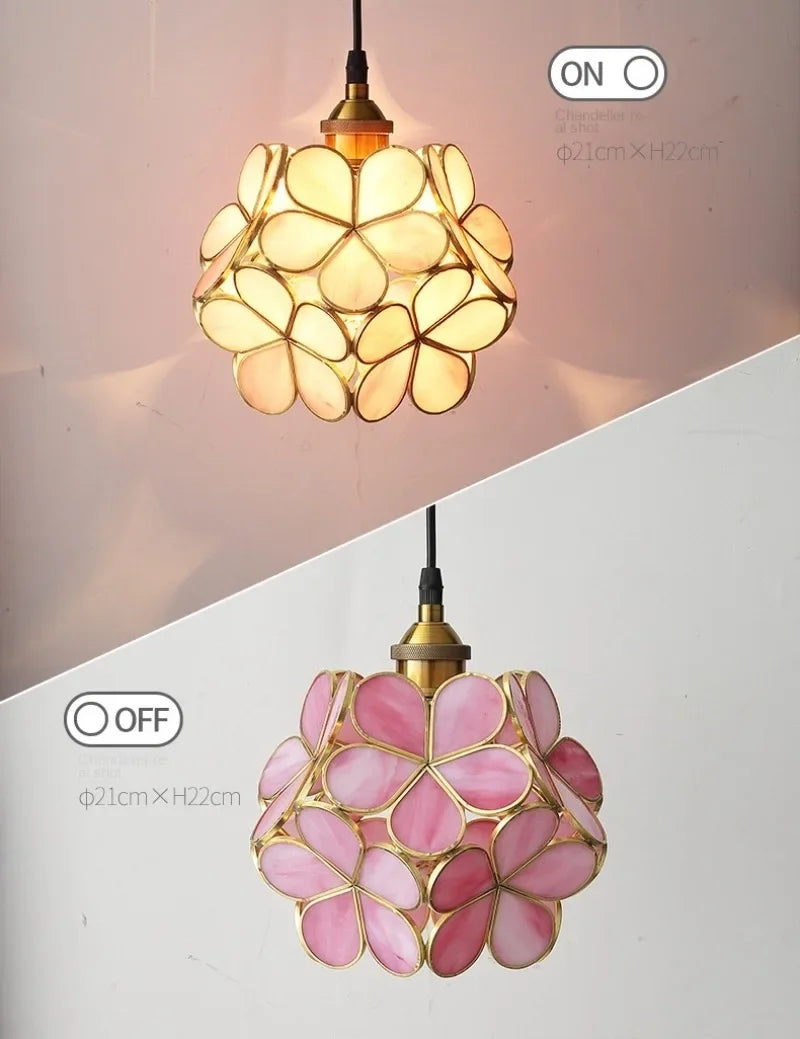 A delicate pink stained glass nordic modern petal acrylic pendant lamp with floral design and brass accents