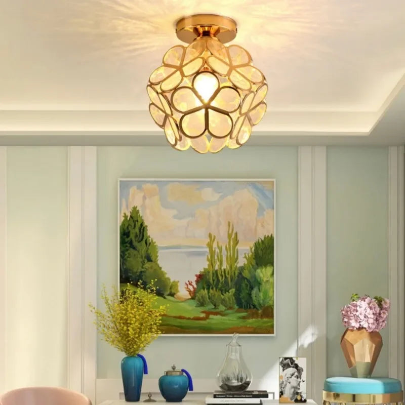 Gold-toned Nordic modern petal acrylic pendant lamp with spherical overlapping glass panels for bedroom and restaurant lighting
