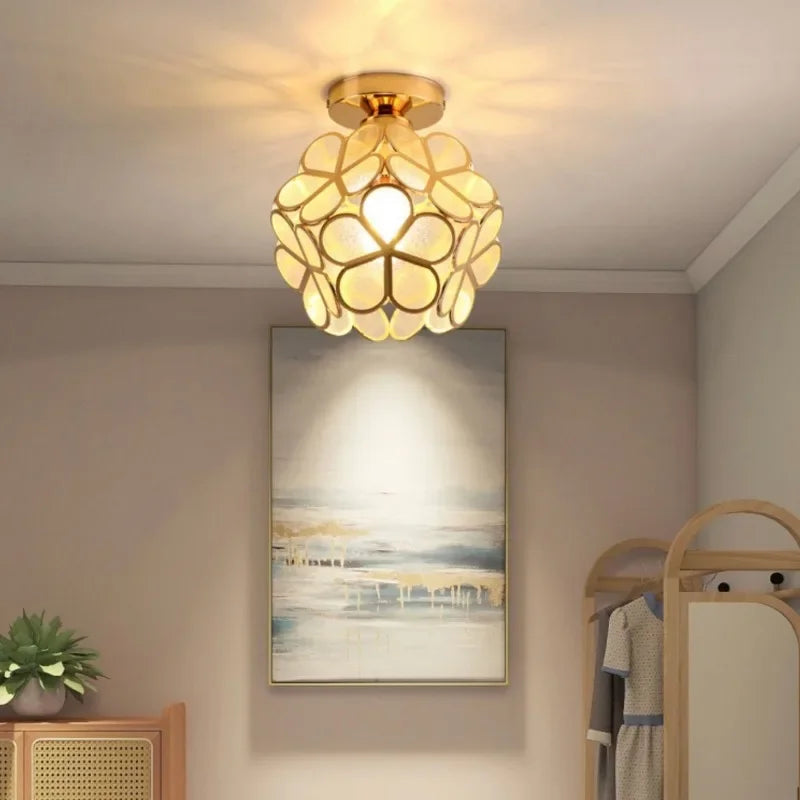 Gold-toned nordic modern petal acrylic pendant lamp with translucent floral glass panels for bedroom and restaurant lighting