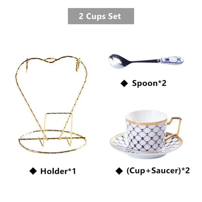 Elegant white bone china coffee set with navy blue geometric patterns and gold rims on matching porcelain saucers