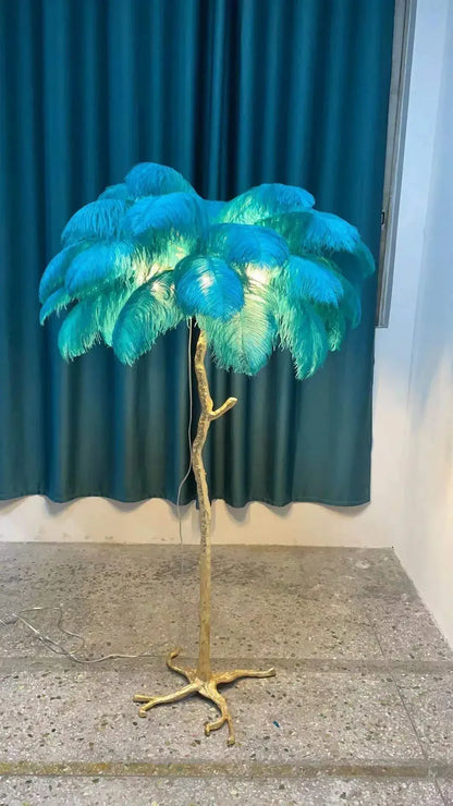 Vibrant turquoise feather floor lamp with golden tree-like stand for living room and bedroom decor lighting
