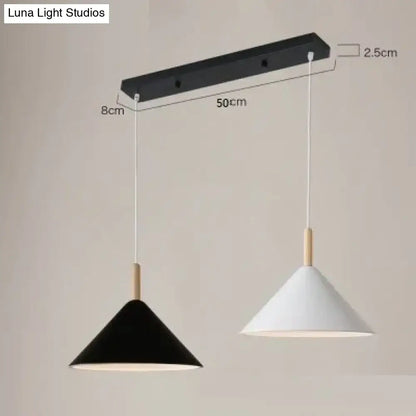 Modern black and white conical pendant light with wooden accents on sleek black bar for nordic simple kitchen use