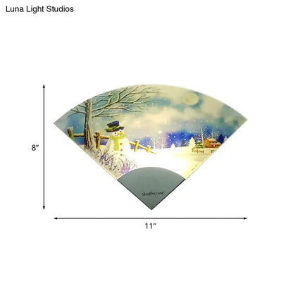 Nordic snowman led fan shaped wall light featuring an illuminated winter scene with snowman and bare trees for bedroom decor