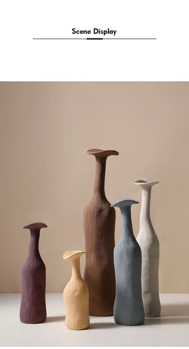 Set of five handcrafted ceramic vases in earthy morandi tones with organic sculptural forms for nordic home decor