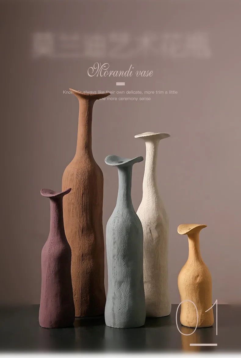 A set of five handcrafted ceramic Morandi color vases in earthy tones with textured surfaces for Nordic home decor
