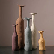 Set of five handcrafted ceramic vases in morandi earthy tones with sculpted necks for nordic modern home decoration