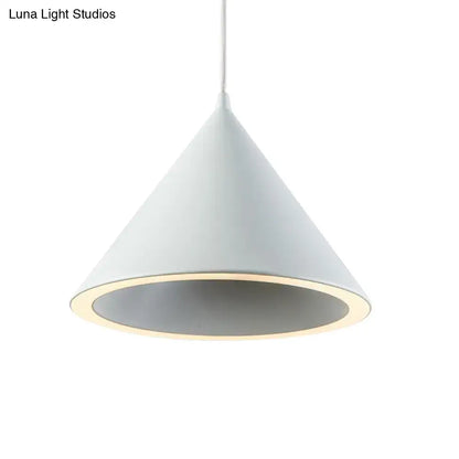 A sleek white conical pendant light with a matte finish and glowing rim for nordic stylish hanging lamp décor