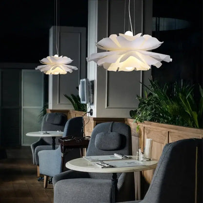 Nordic white acrylic flower pendant chandelier with layered petal-shaped lights offering a soft glow for bedroom decor
