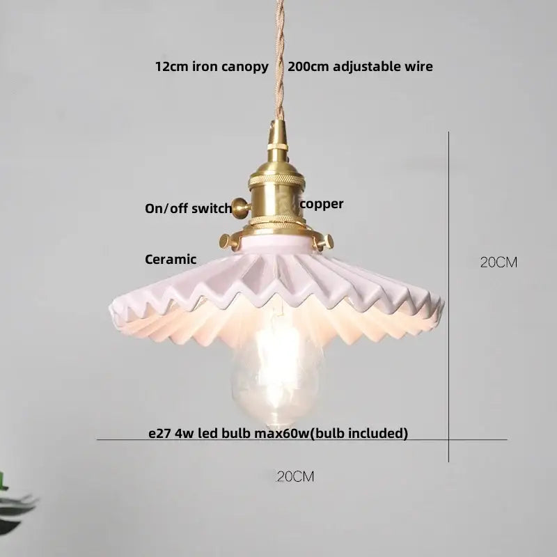 A delicate pink ceramic pendant light with brass copper switch and iron canopy complements decorbites brown wood led decor