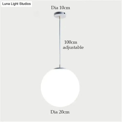 A decorbites™ nordic white glass ball pendant light with a 20cm diameter and adjustable 100cm chain for modern interiors