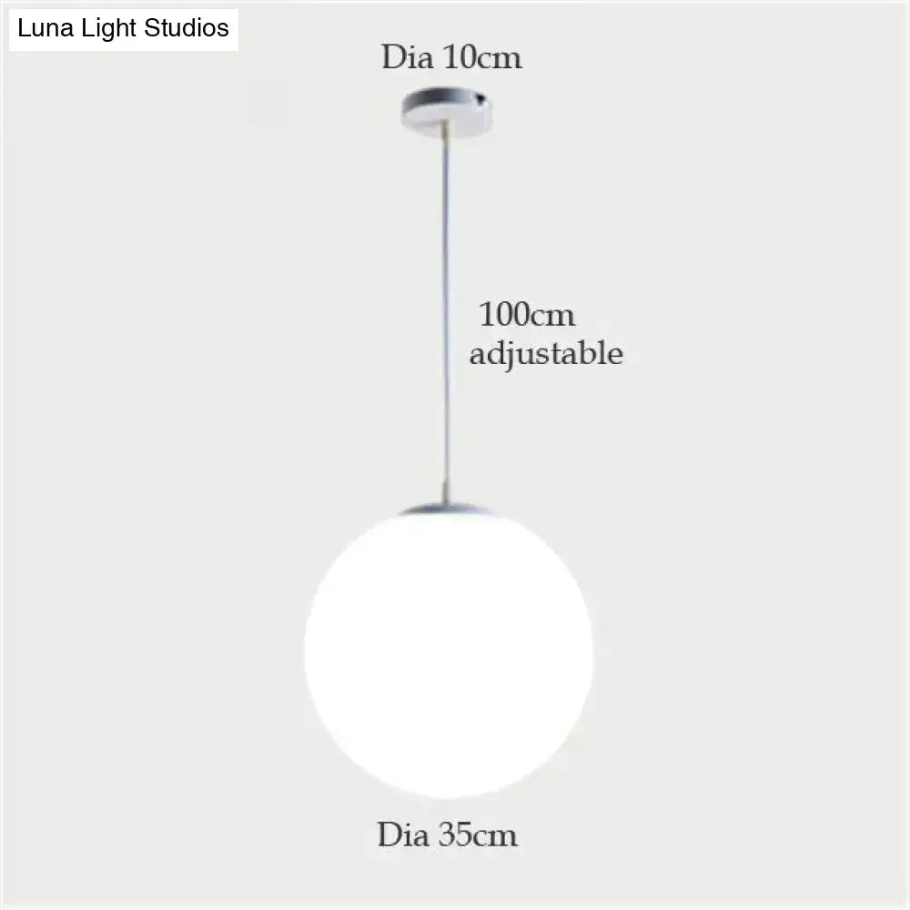 DecorBites nordic white glass ball pendant lights with frosted glass globe and chrome hardware for modern living rooms