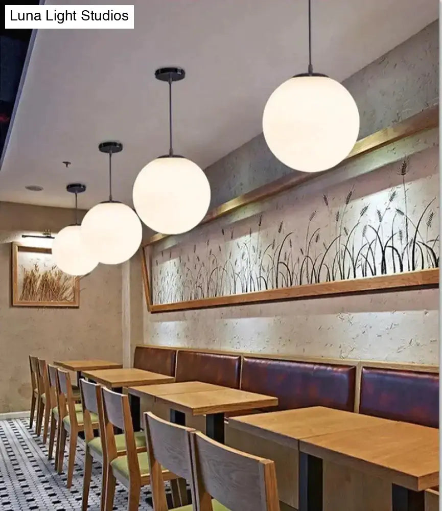 Decorbites™ nordic white glass ball pendant lights with white spherical glass and black metal fixtures for modern living rooms