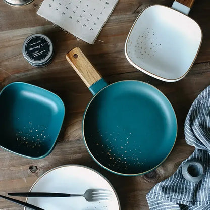 Teal ceramic frying pan with wood handle and gold speckles from decorbites ceramic wood handle collection