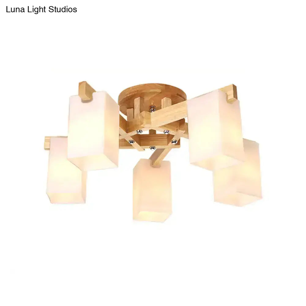 Modern wooden ceiling lamp with five cuboid cream glass shades for living room lighting