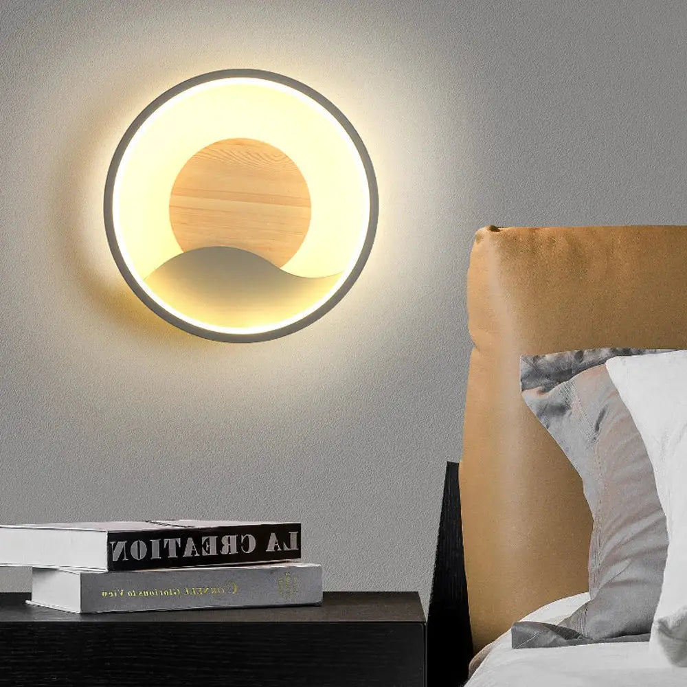 Nordic wood and led wall light with warm glow featuring minimalist concentric rings and central wooden disc decorbites led wall