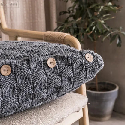 Gray knitted cushion cover with woven texture and three natural wood buttons for nordic decorbites knit pillow