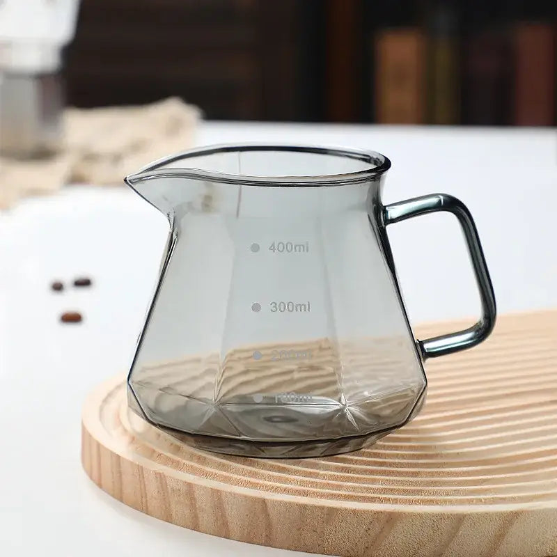 Octagonal clear glass coffee kettle with faceted design black metal handle and measurement lines for decorbites glass coffee