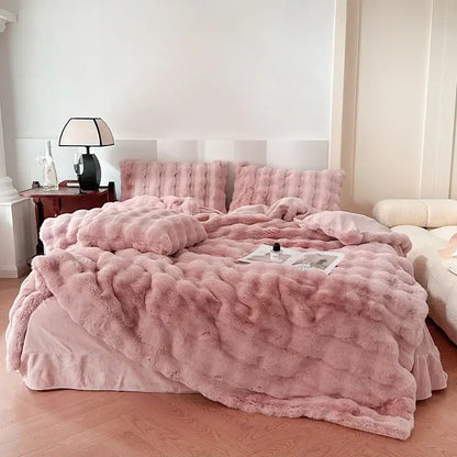 Pink plush faux fur comforter set with textured surface and matching pillows from decorbites deluxe faux rabbit bedding set
