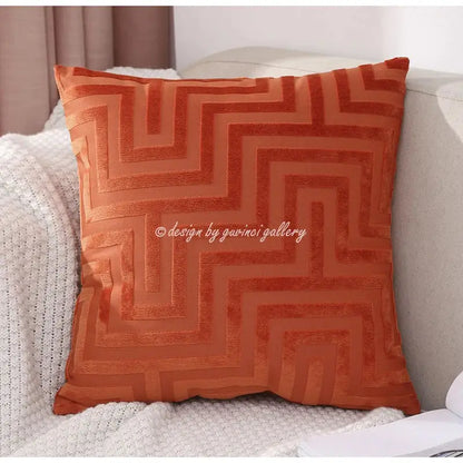 A square rust-orange velvet decorbites geometric jacquard throw pillowcase with raised zigzag pattern for living room