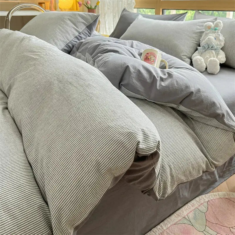 Gray striped duvet cover with subtle vertical lines in soft textured cotton finish from olive and cream cotton striped bedding set