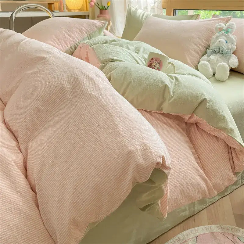Pastel pink and mint green textured cotton duvet set with subtle ribbed pattern in decorbites cozy striped cotton bedding set