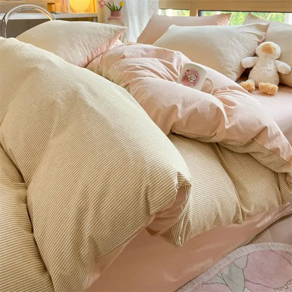Olive green and cream cozy striped cotton bedding set featuring a cream striped duvet with soft fabric and pink pillowcases