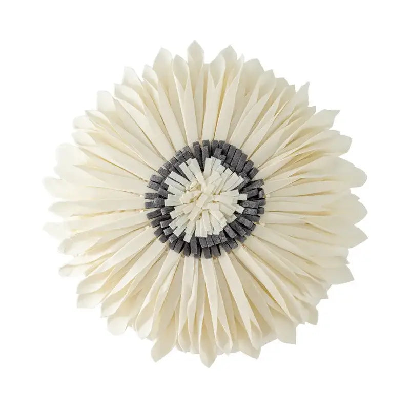 Cream-colored layered paper flower with dark gray center on olive green decorbites handmade flower cushion cover