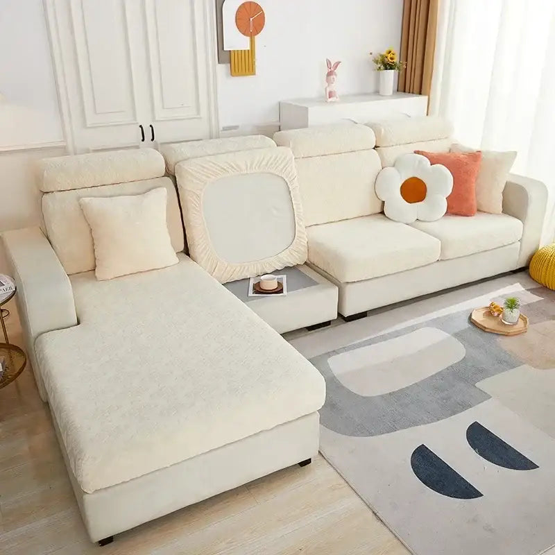 Cream-colored plush sofa seat cover with soft textured fabric and elasticized edges for snug fit and living room protection