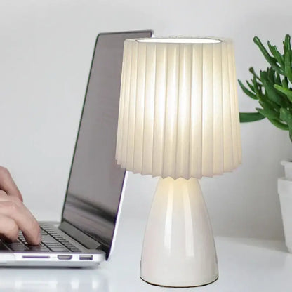 Orange ceramic milkshake bedside lamp with cream pleated lampshade and glossy white ceramic base by decorbites ceramic milkshake
