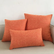 Set of three orange textured linen cushion covers in varying sizes for decorbites ivory sofa cushion decor