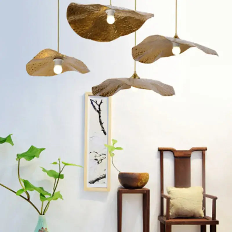 Organic golden iron lotus leaf pendant light with textured hammered iron lotus leaf design for dining room decorbites golden iron