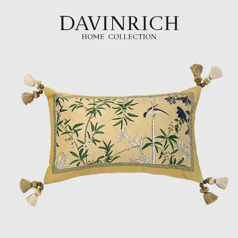 A rectangular beige orchid velvet lumbar pillow cover with embroidered green bamboo leaves and blue birds from davinrich home