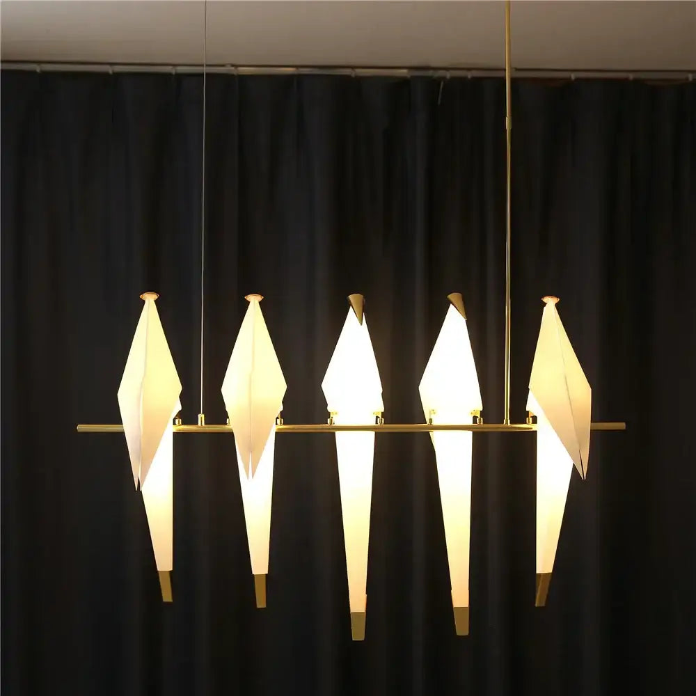 Modern origami crane bird design led pendant light with five white paper shades on gold metal frame for dining room decorbites bird design