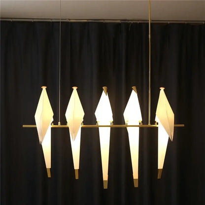 Modern origami crane bird design led pendant light with five white paper shades on gold metal frame for dining room decorbites bird design