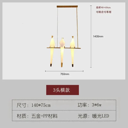 A modern three-head bird design led pendant light with brass frame and white bird-shaped shades for dining room decorbites bird design