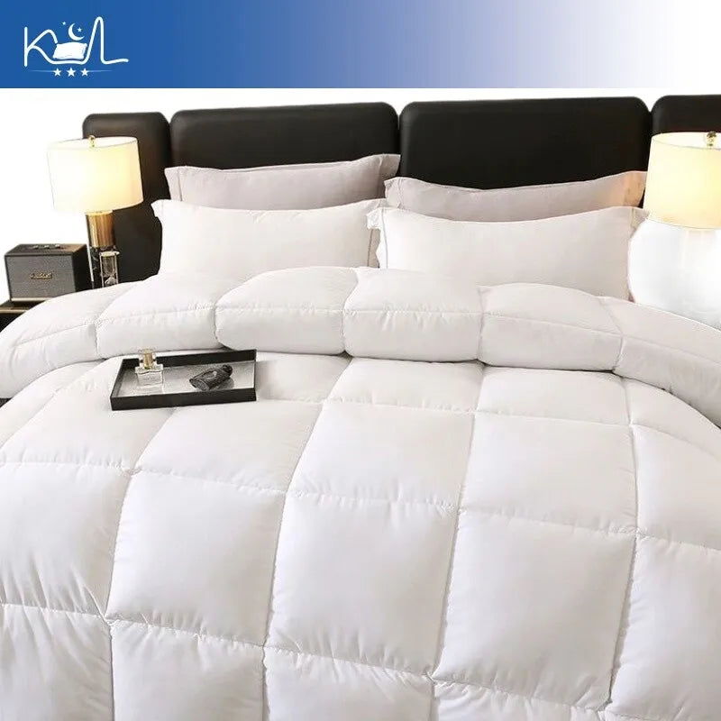 White quilted comforter with plush texture and square stitched panels made of 95% white goose down for warmth