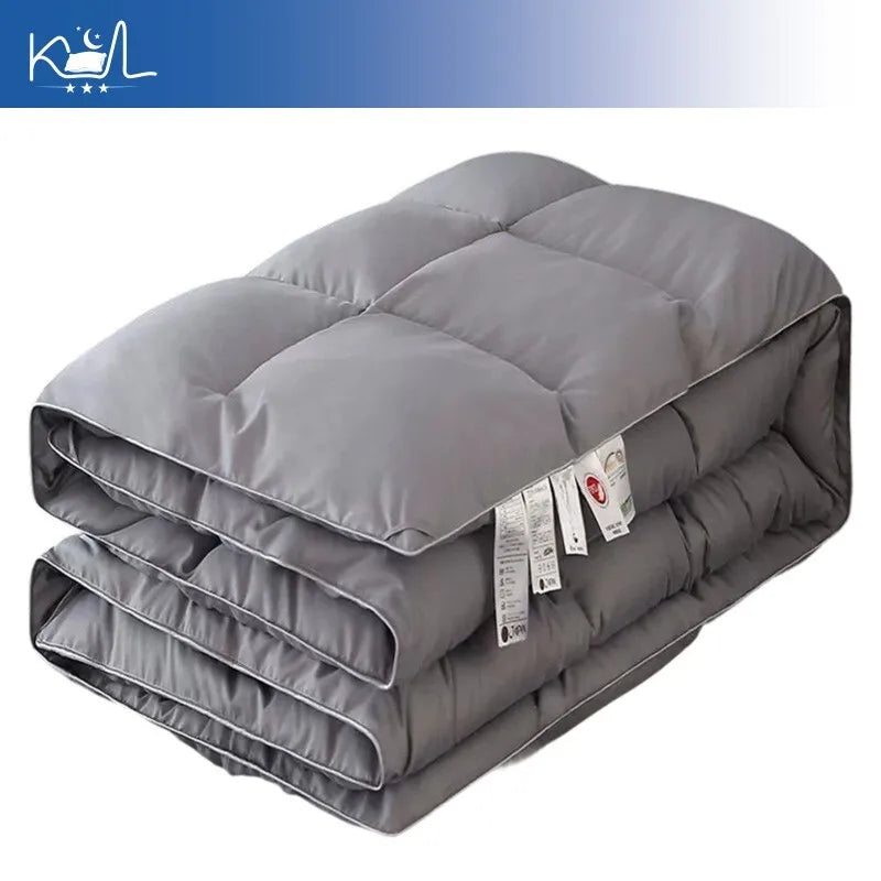 Gray quilted down comforter with subtle stitching made of 95 percent white goose down for warm spring autumn winter use