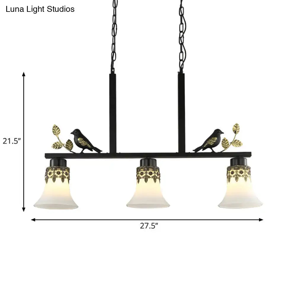 DecorBites classic black island pendant light with three frosted glass shades, gold detailing, and decorative birds