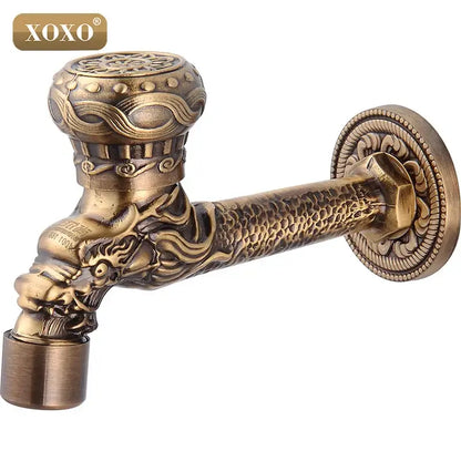 Antique brass faucet tap with intricate decorbites dragon style head and ornate textured detailing for bathroom mount