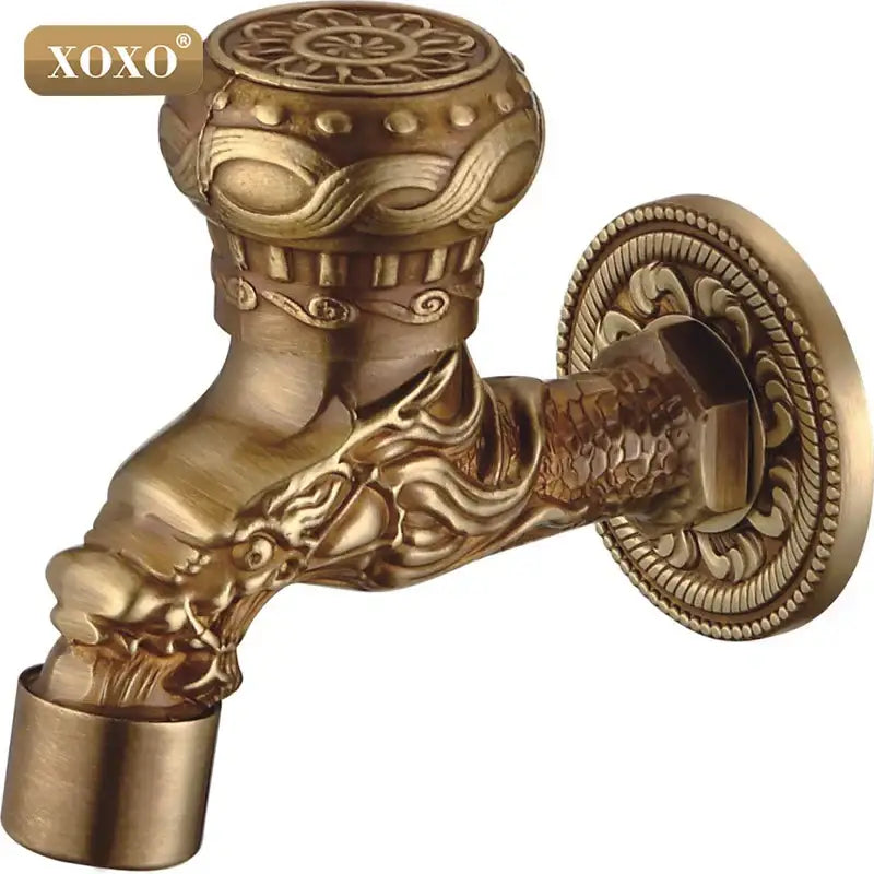 Ornate brass faucet tap with intricate xoxo decorbites dragon style head and decorative floral patterns for bathroom mount