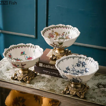 Three ornate ceramic flower pattern fruit bowls with colorful flower pattern and gold-toned decorative bases for dining room use