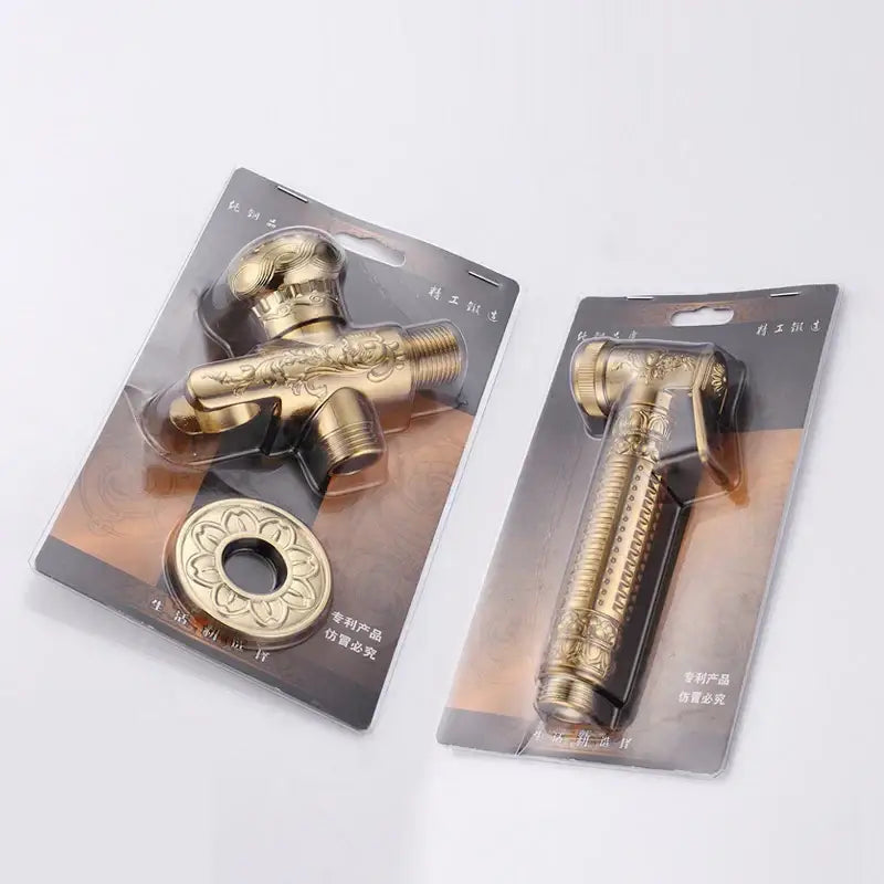 Ornate engraved gold brass wall mounted bidet faucet with floral scrollwork in clear plastic blister packs for decorbites brass wall use