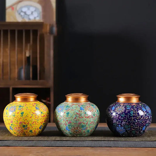 Ornate ceramic storage jar set with vibrant floral patterns and gold lids ideal for kitchen tea pot or coffee storage
