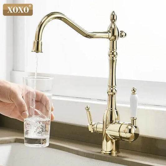 Ornate gold and white decorbites kitchen faucet mixer tap with ceramic handles and intricate detailing