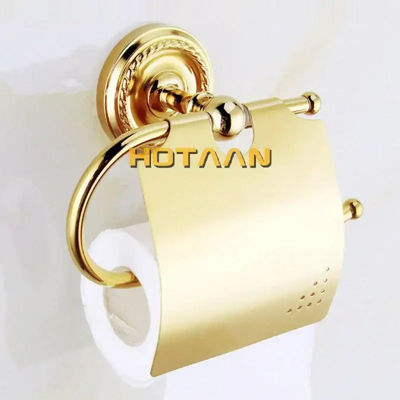 Gold-finished brass toilet paper holder with ornate wall mount and decorative ball accents from decorbites brass bathroom set