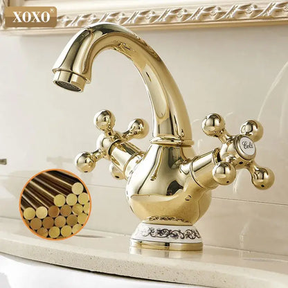 Ornate gold xoxo basin faucet with double handle chrome cross handles and decorative base for bathroom use