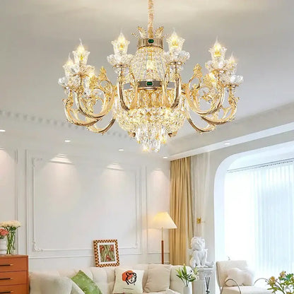 Ornate gold crystal dining room chandelier with green gemstone accents perfect for decorbites crystal dining decor