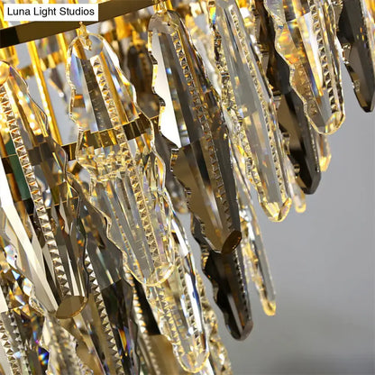 DecorBites™ minimalist crystal leaf pendant light features a gold-toned fixture with clear crystal prisms for bedrooms